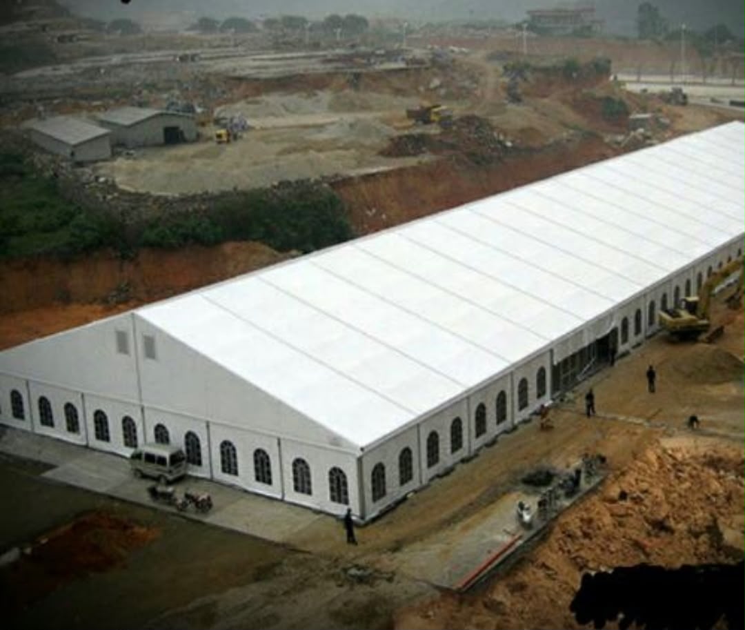 Aerial view of a large industrial warehouse structure with site excavation works